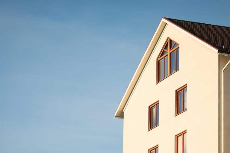 Beige-Concrete-House-Under-Cumulus-Cloud
